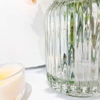 Faux Spring Floral Arrangement In A Textured Glass Vase
